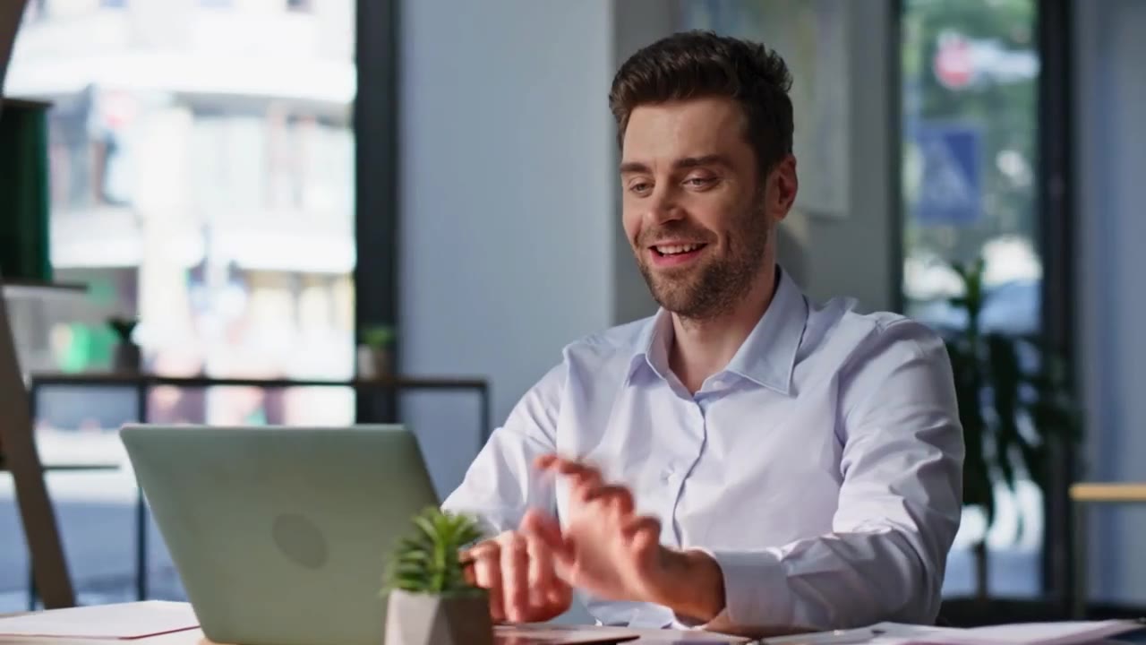 A treasurer working on a laptop at a desk